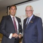 Luigi Wewege being congratulated by Charles E. Hoffman the Dean of the College of Business Administration at UMSL in St. Louis, Missouri.